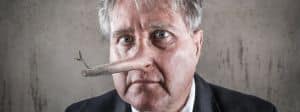 Un homme d'affaires avec le nez de Pinocchio